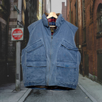 Load image into Gallery viewer, Front zipped vintage blue, zip-up, Eddie Bauer puffer vest w/ 2 chest pockets &amp; 2 bottom pockets that fasten with Velcro. Lined with plaid cotton material. Good Kid Collective hand-picked this item.
