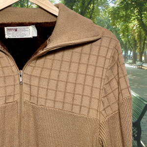 Close-up vintage tan, cozy zip-up jacket with a fuzzy, dark-brown liner. Made in Korea for Montgomery Ward. Good Kid Collective hand-picked this item.