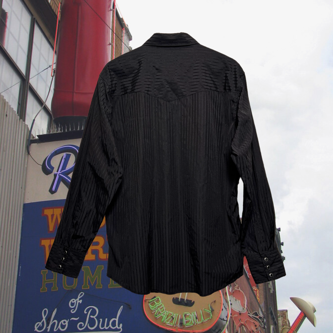 Back of black, western Wrangler button-up shirt w/ black snap buttons and subtle black stripes. Good Kid Collective hand-picked this item.